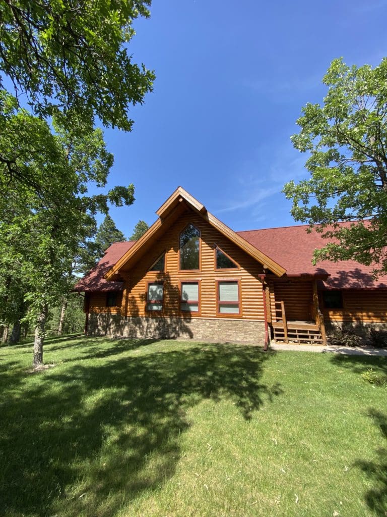 stained log cabin in the Black Hills