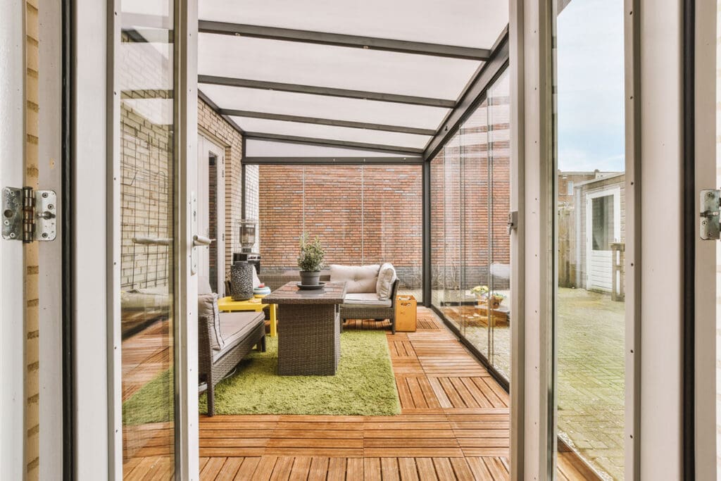 New three season sunroom with seating area